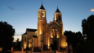 Zambrow by night including churches, popes and bison.