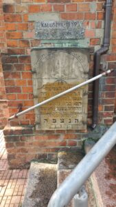 The only readable tombstone in Kałuszyn found in a church wall, plus the cemetery monument